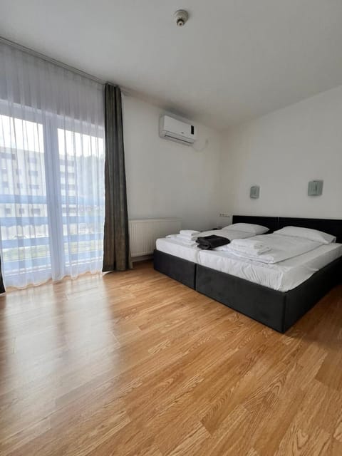 Bed, Photo of the whole room, Bedroom, towels, air conditioner