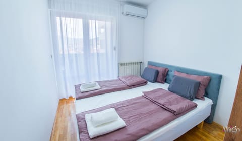 Bed, Photo of the whole room, Bedroom, towels, air conditioner