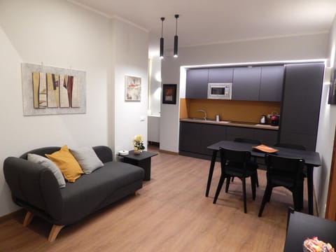 TV and multimedia, Kitchen or kitchenette, Living room, Seating area, Dining area, dishwasher, flat iron, oven, stove, kitchen, air conditioner