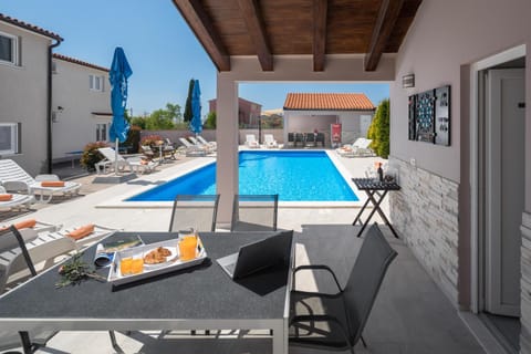 Property building, Seating area, Swimming pool