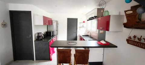 Kitchen or kitchenette, dishwasher, oven, stove