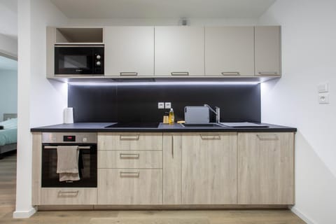 Kitchen or kitchenette, oven