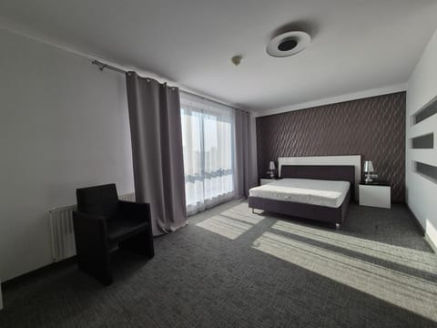 Bed, Seating area, Bedroom