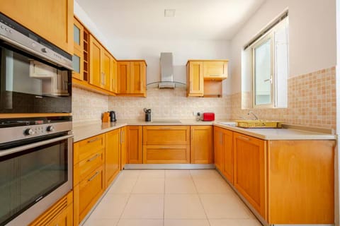 Kitchen or kitchenette, dishwasher, oven, stove, toaster
