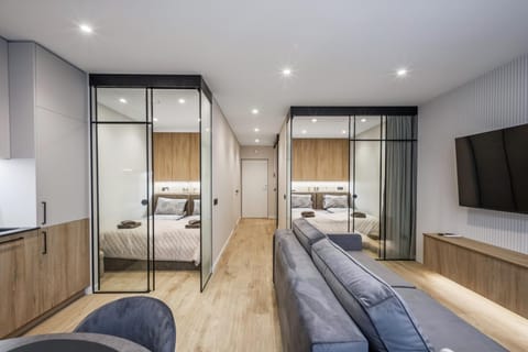 Communal lounge/ TV room, Bed, TV and multimedia, Living room, Photo of the whole room, Seating area, Bedroom