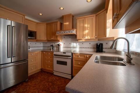 Kitchen or kitchenette, dishwasher, microwave, oven, stove, toaster