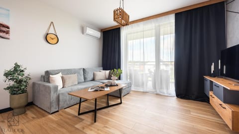 Bed, TV and multimedia, Living room, Seating area, air conditioner