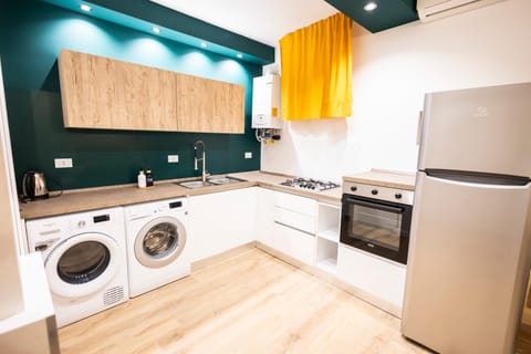 Kitchen or kitchenette, oven, stove, washing machine, dryer