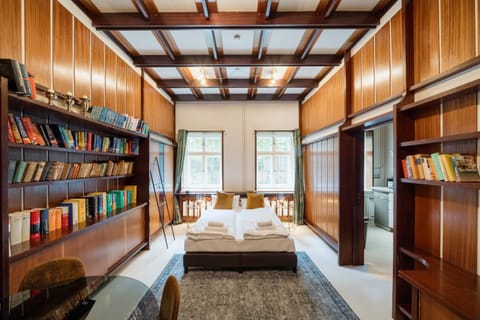 Bed, Library, Seating area, Dining area, Bedroom