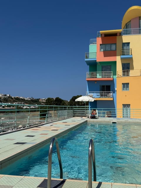 Property building, Pool view, Swimming pool, sunbed