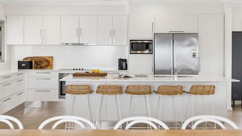 Kitchen or kitchenette, dishwasher, oven, stove, toaster