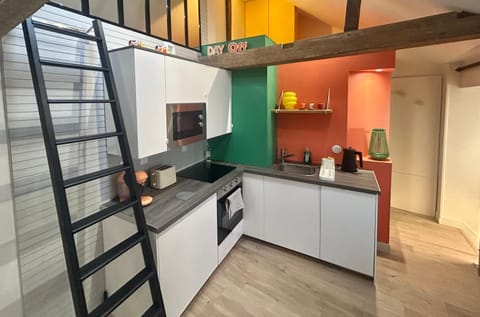 Kitchen or kitchenette, dishwasher, oven, stove