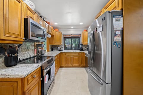 Kitchen or kitchenette, dishwasher, oven, stove