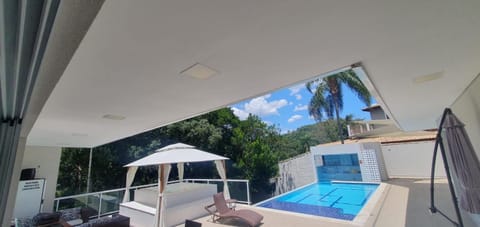 Patio, Day, Natural landscape, Pool view, Swimming pool, sunbed