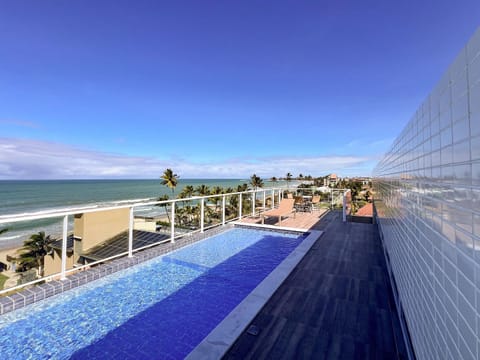 Natural landscape, View (from property/room), Balcony/Terrace, Seating area, Beach, Pool view, Sea view, Area and facilities, Swimming pool, sunbed