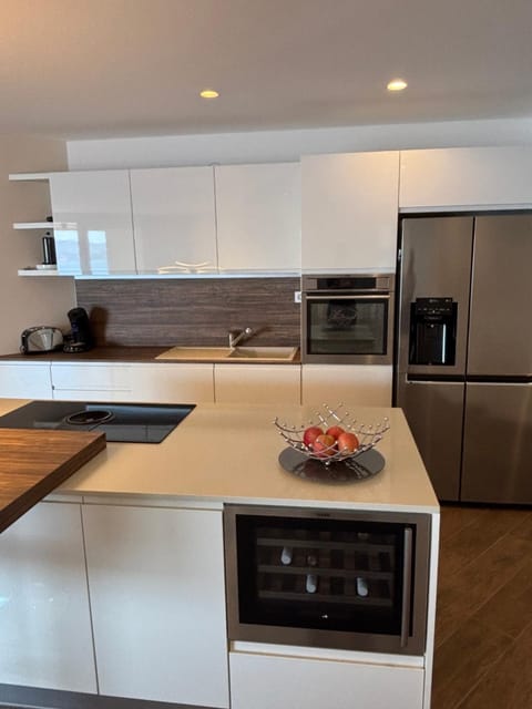 Kitchen or kitchenette, dishwasher, oven, stove