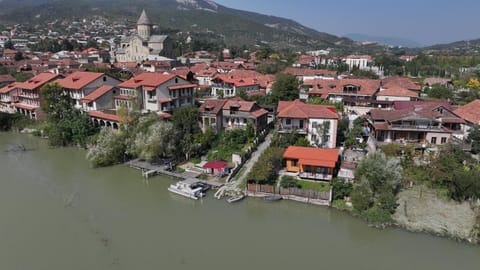 Property building, Nearby landmark, Day, Neighbourhood, Natural landscape, Mountain view, River view, Street view