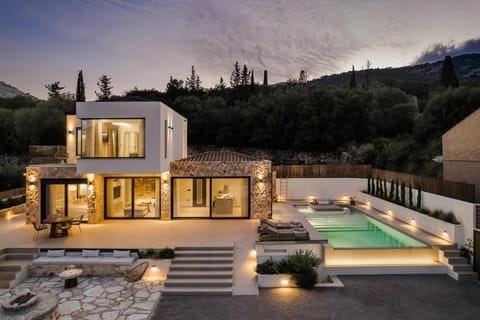 Property building, Patio, Night, Natural landscape, Mountain view, Pool view, Swimming pool, sunbed