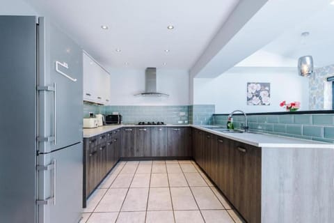 Kitchen or kitchenette, dishwasher, oven, stove