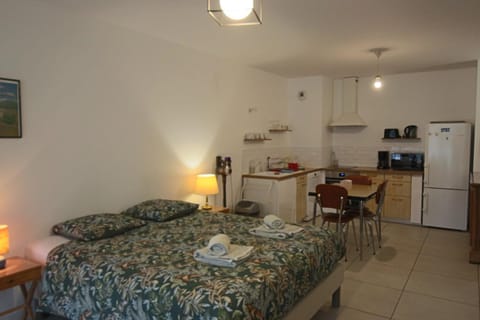 Bed, Dining area, microwave, oven, kitchen