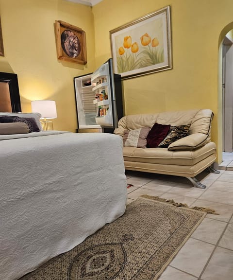 Bed, Living room, Seating area, Bedroom
