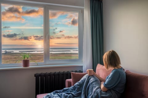 View (from property/room), Living room, Seating area, Sunrise