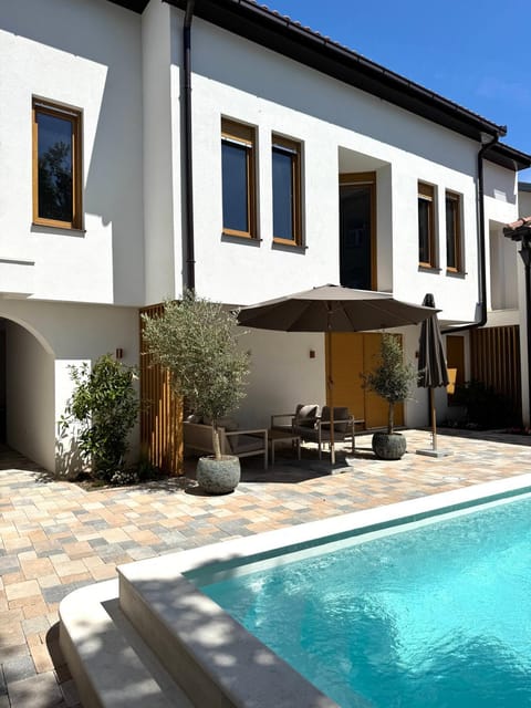 Property building, Patio, Day, Pool view, Swimming pool