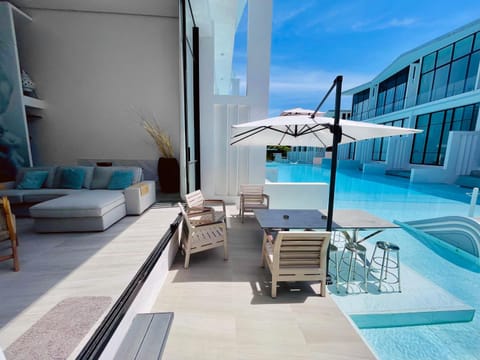 Bed, Off site, Balcony/Terrace, Balcony/Terrace, Living room, Seating area, Pool view, Swimming pool