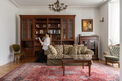 People, Library, Living room, Seating area