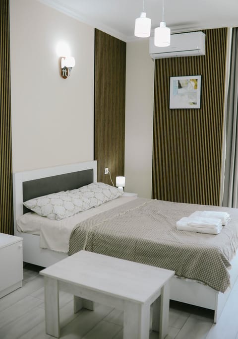 Bed, Photo of the whole room, Bedroom, towels, air conditioner