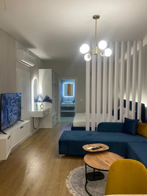 Bed, TV and multimedia, Living room, Seating area, Bedroom