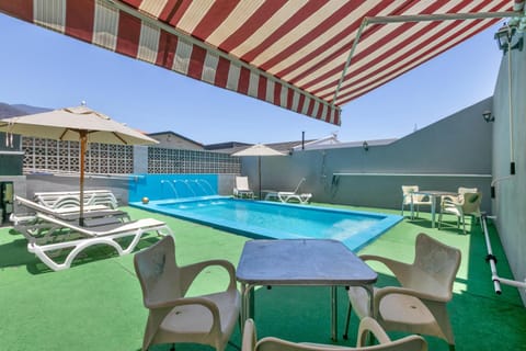 Property building, Living room, Swimming pool