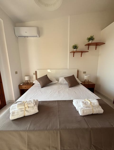 Bed, Photo of the whole room, Bedroom, towels, air conditioner