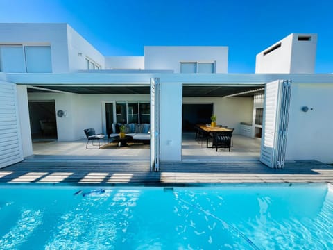 Property building, Patio, Day, Dining area, Pool view, Swimming pool