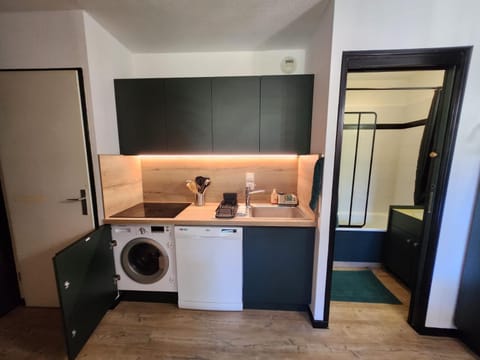 Kitchen or kitchenette, dishwasher, stove, washing machine, dryer