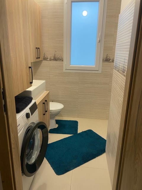 Shower, Toilet, Bathroom, towels, washing machine, dryer