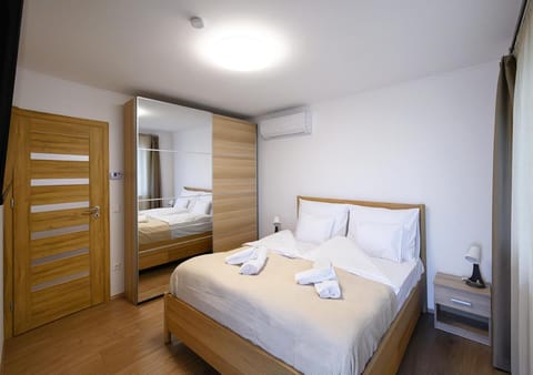 Bed, Bedroom, towels, wardrobe, air conditioner