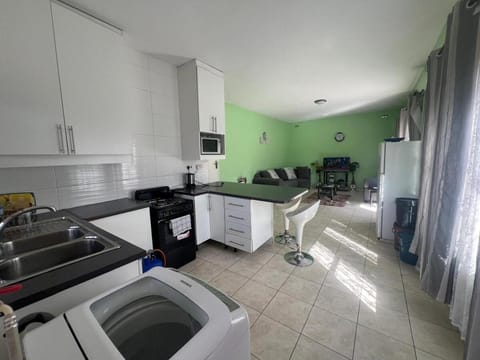 Seating area, minibar, oven, stove, washing machine