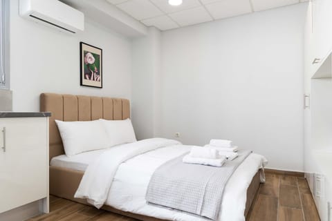 Bed, Photo of the whole room, Bedroom, towels, air conditioner