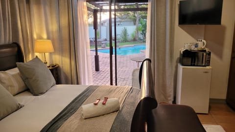 TV and multimedia, View (from property/room), Bedroom, Pool view, towels