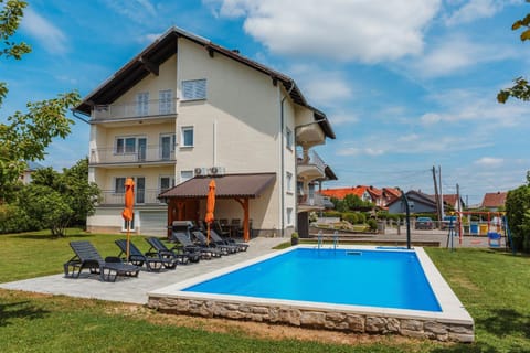 Property building, Patio, Spring, Day, Garden, Garden view, Pool view, Swimming pool, sunbed
