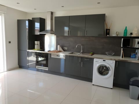 Kitchen or kitchenette, dishwasher, oven, stove, washing machine