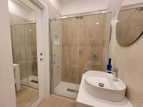 Shower, Toilet, Bathroom, hair dryier, towels