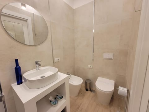 Shower, Toilet, Bathroom, bidet, hair dryier, towels