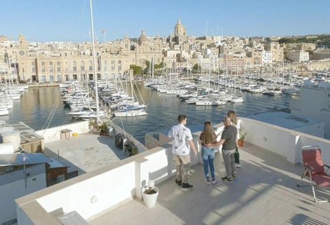 People, Natural landscape, Balcony/Terrace, City view, group of guests