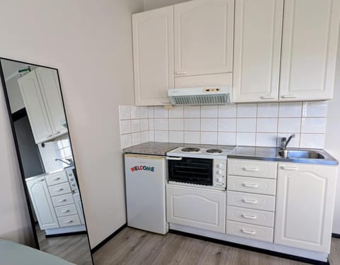 Kitchen or kitchenette, oven, stove