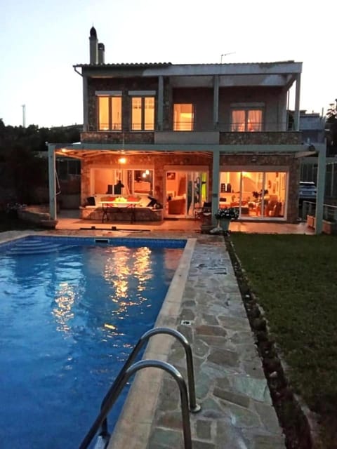 Property building, Patio, Night, Pool view, Swimming pool