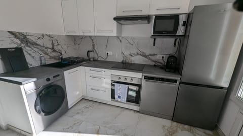 Kitchen or kitchenette, dishwasher, oven, stove, washing machine, kitchen