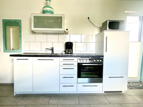 Kitchen or kitchenette, oven, stove
