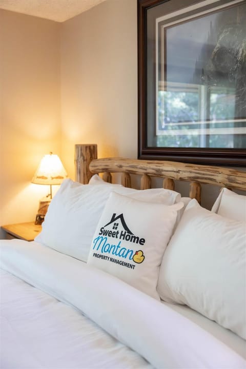 Bed, Property logo or sign, Bedroom